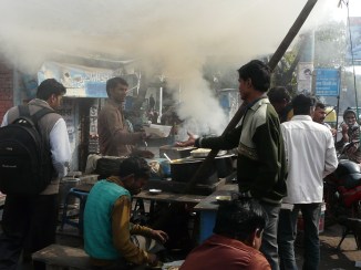 Serving a late breakfast and getting the tandoor fired up for the day, Raja ki Mandi, Agra